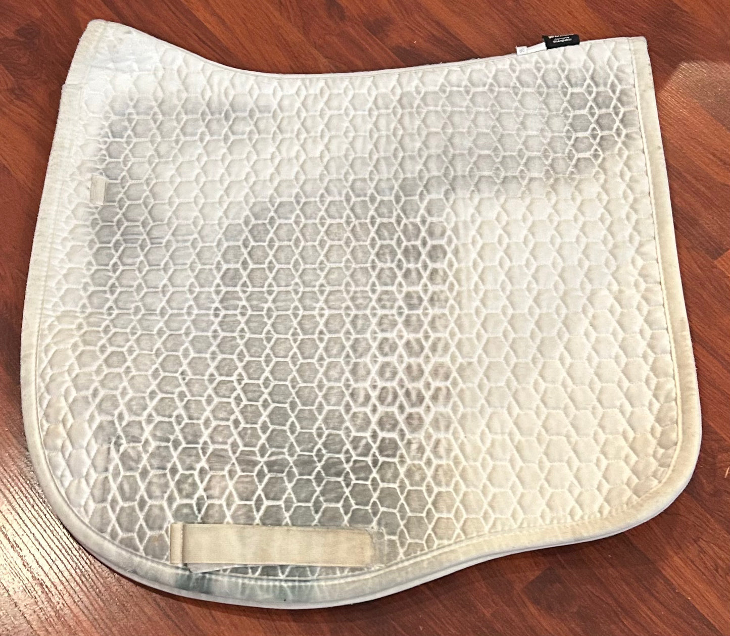 Mattes white large dressage pad. Discoloured under saddle area.