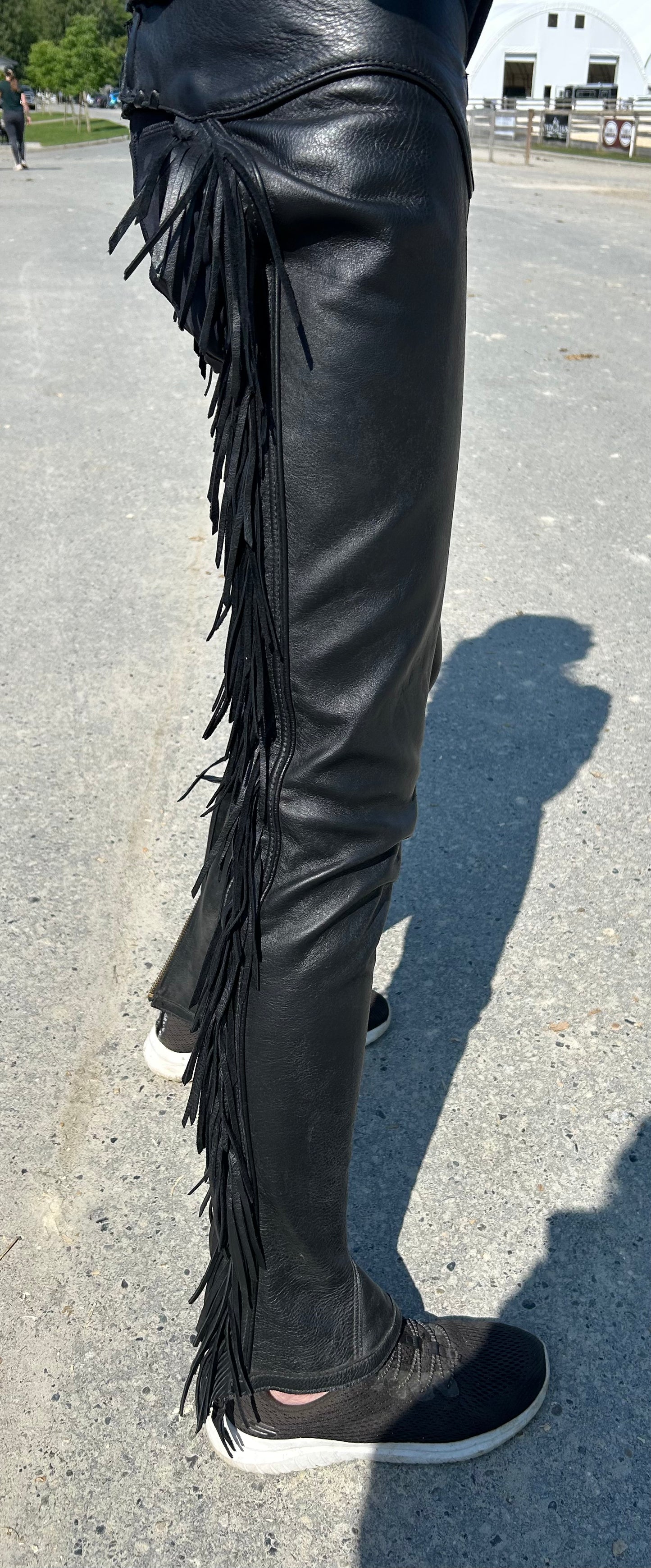 Lynn Saunders full chaps with fringe. Black. Inside leg 31”. Outside leg (waist to bottom) 40”. 13.5” calf. Waist 30”- 27” excellent condition.
