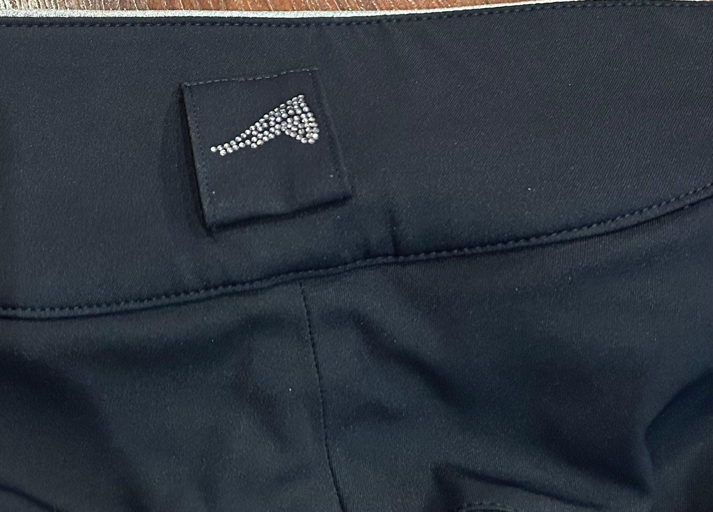 Euro star size 42 (US 12. Measures 32”) navy full seat breeches in new condition. Bling on pockets