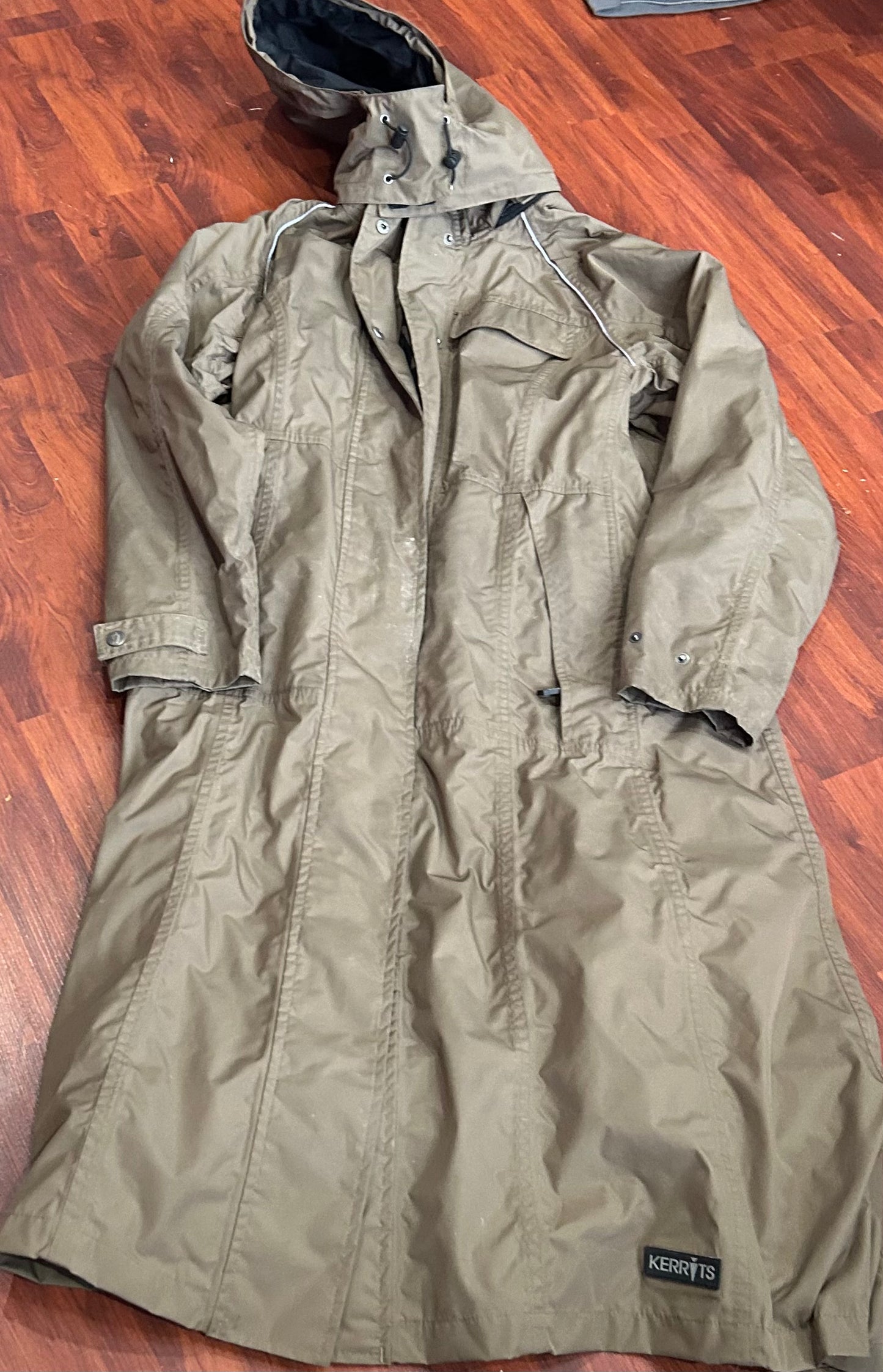 Kerrits medium long winter coat. Snaps up back. Removable hood. Zippers under arms for ventilation some dirt from use.