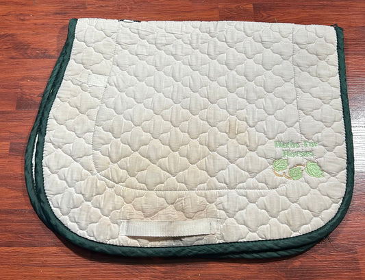 Baby pad with green trim AP. Says “Herbs for Horses”