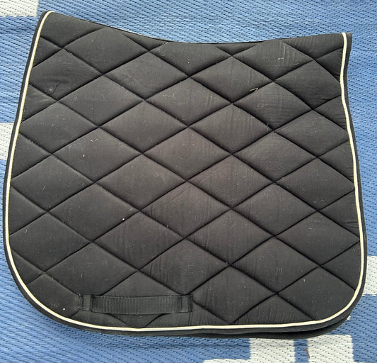 Black with white trim quilted dressage pad. Dirty