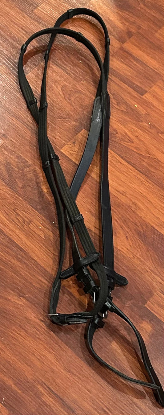 Black webbed reins with hand stops. Not stamped but high quality. Buckle closures