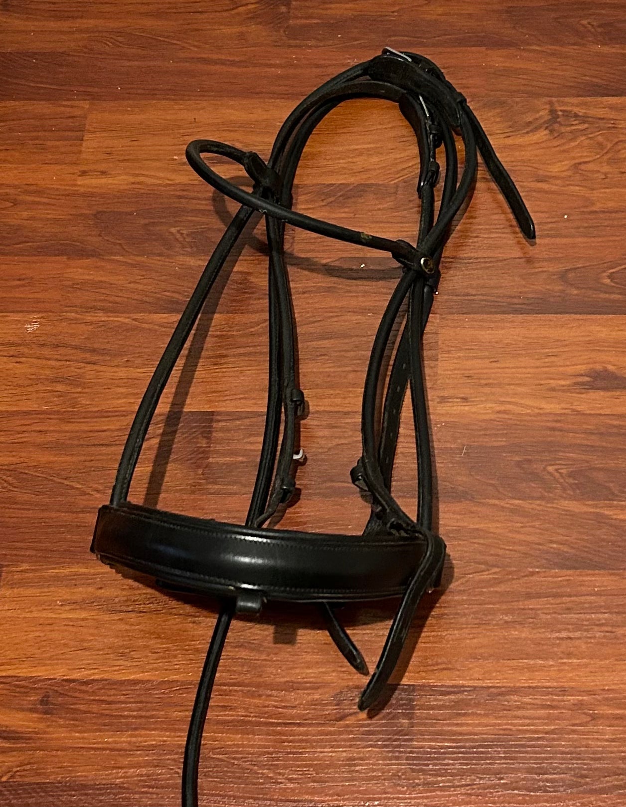 Rolled black snaffle bridle