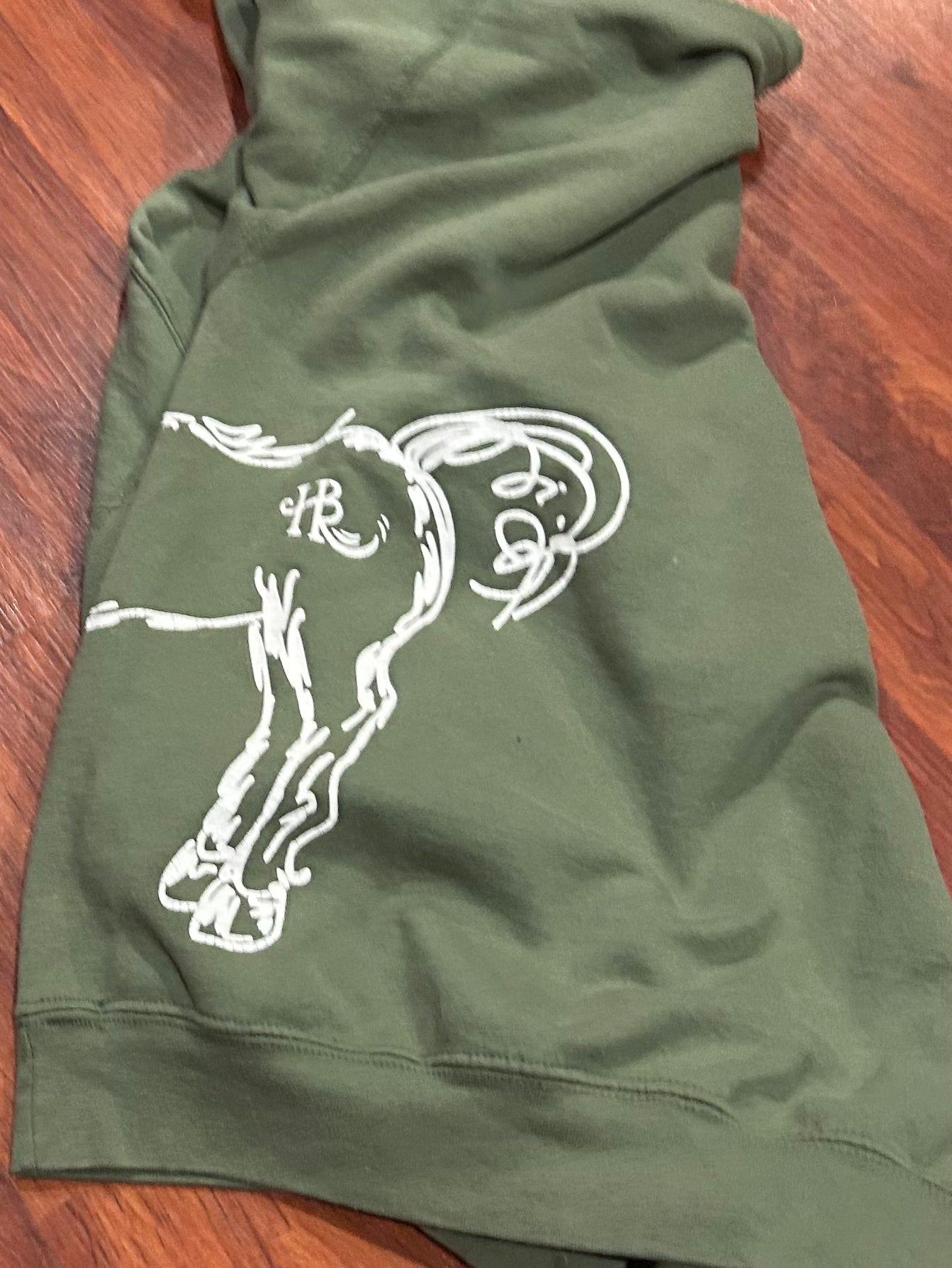 Large green hoodie. With horse. Missing hood string.