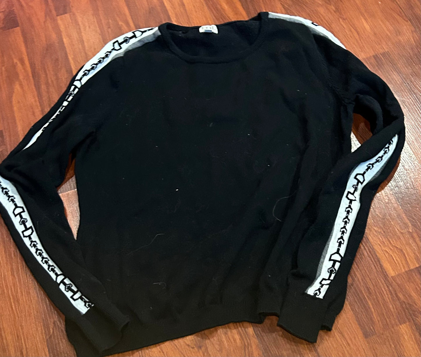 EQL by Kerrits small black sweater with bit pattern on arm