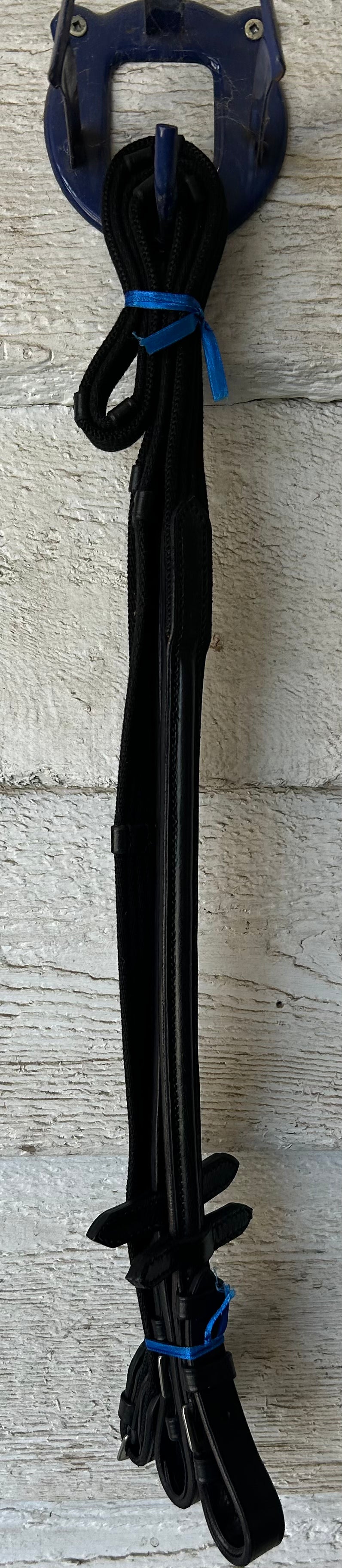 Black reins buckle closure, raised leather. Nylon with stops. Brand new