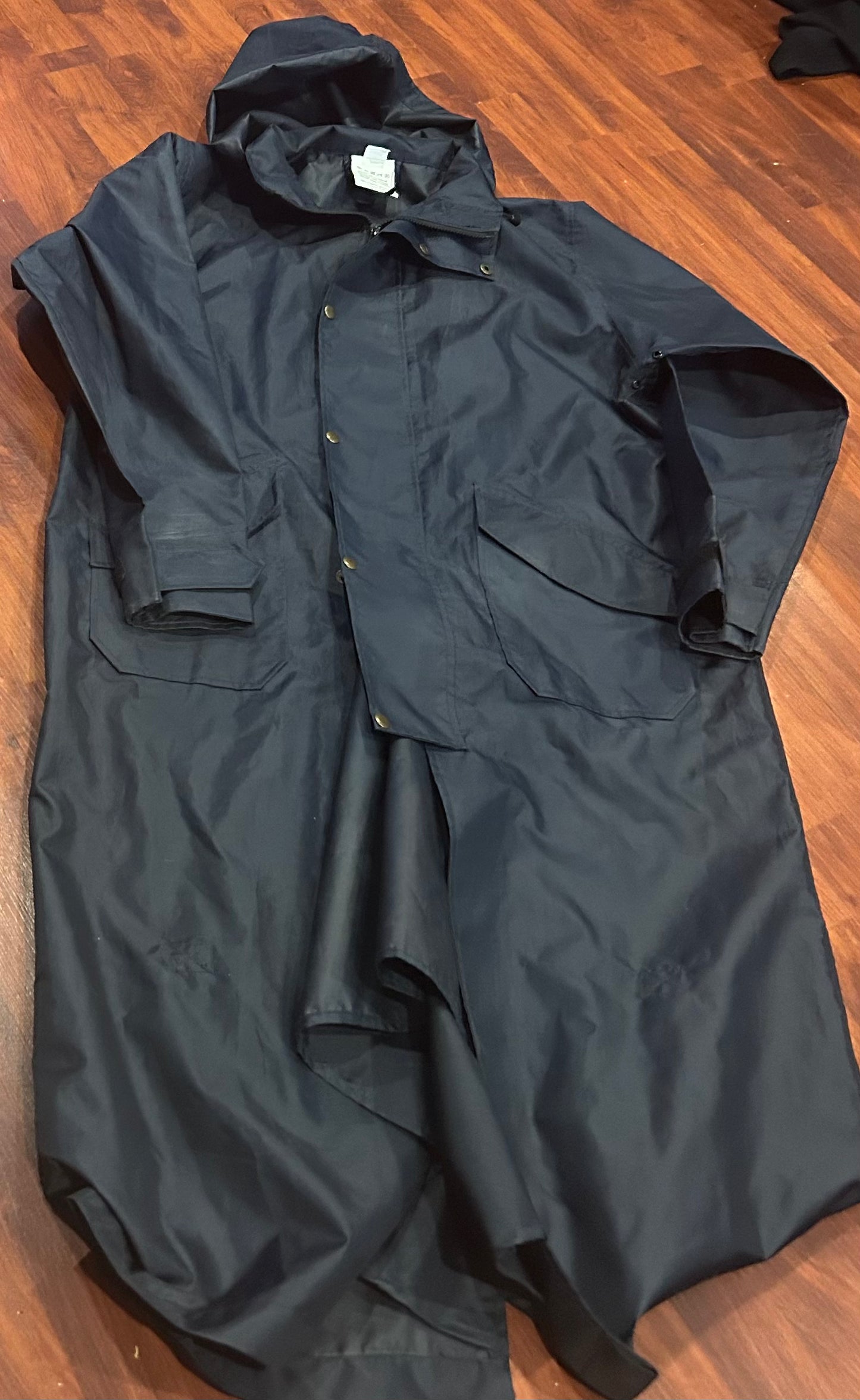 Rain coat. Navy large. Long with taped seams. No brand. Zipper minor resew needed. Opens at back for riding