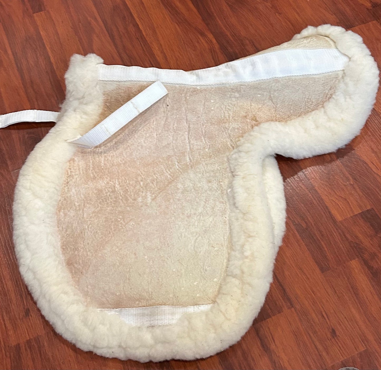 Sheepskin shaped pad measures 19”