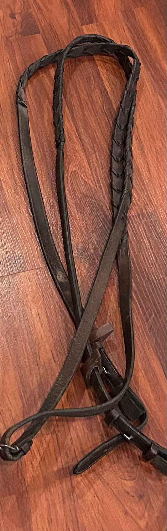Brown laced fancy stitch reins. Some wear