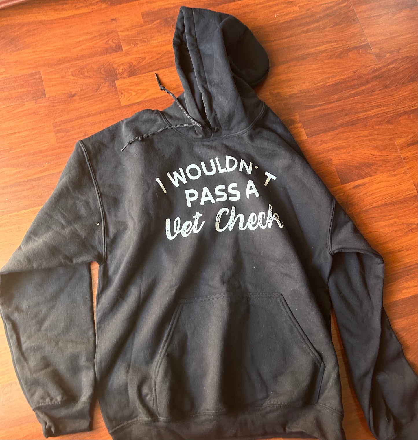 Large wouldn’t pass a vet check black hoodie
