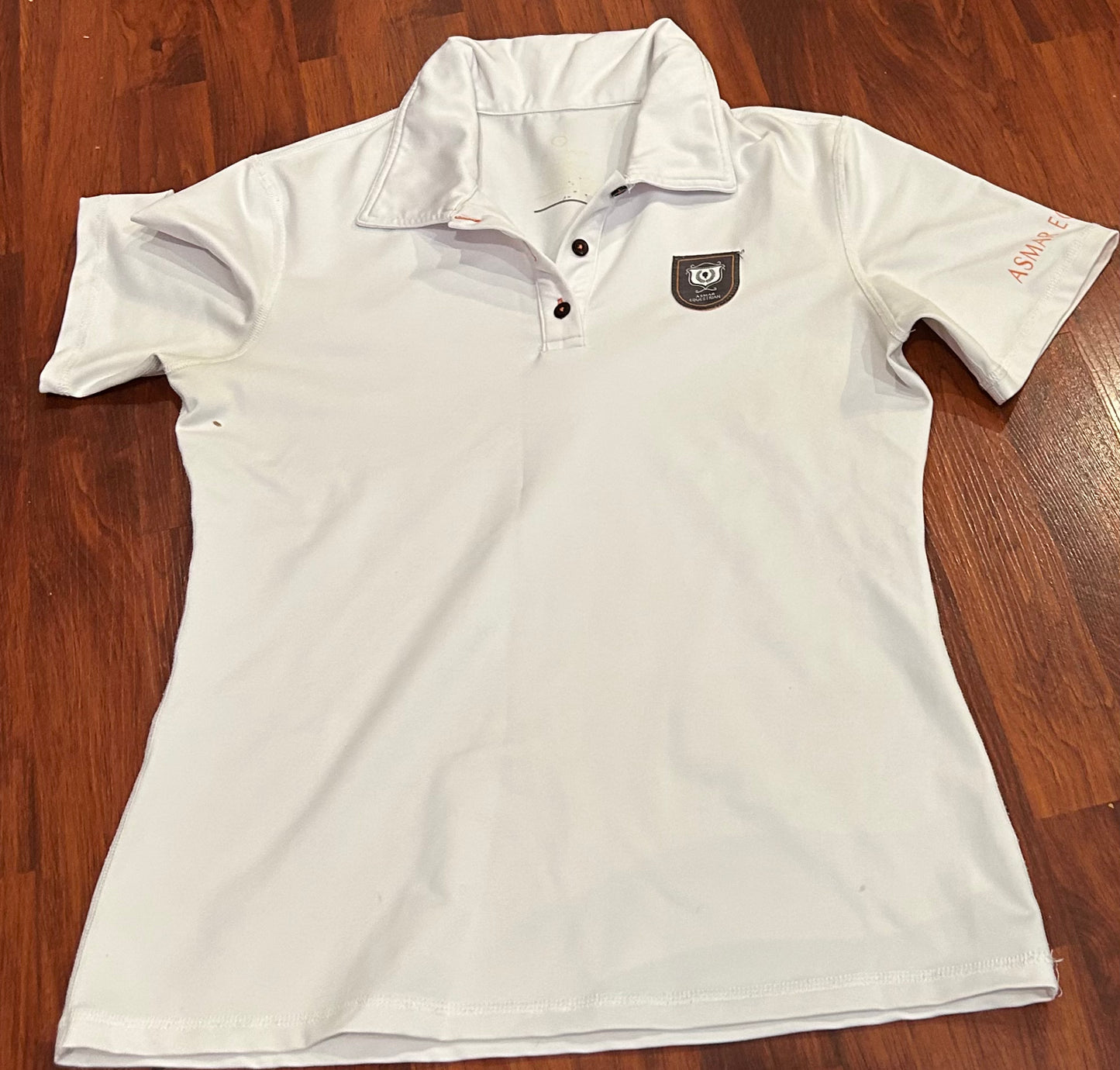 Asmar med white polo shirt. Small stain