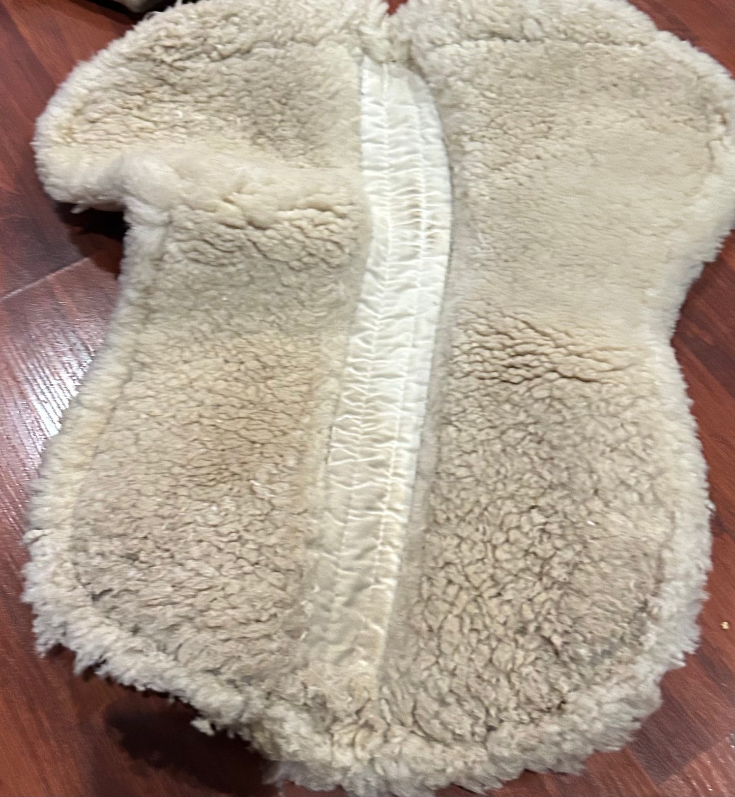 Mattes medium white half pad. Some damage to sheepskin