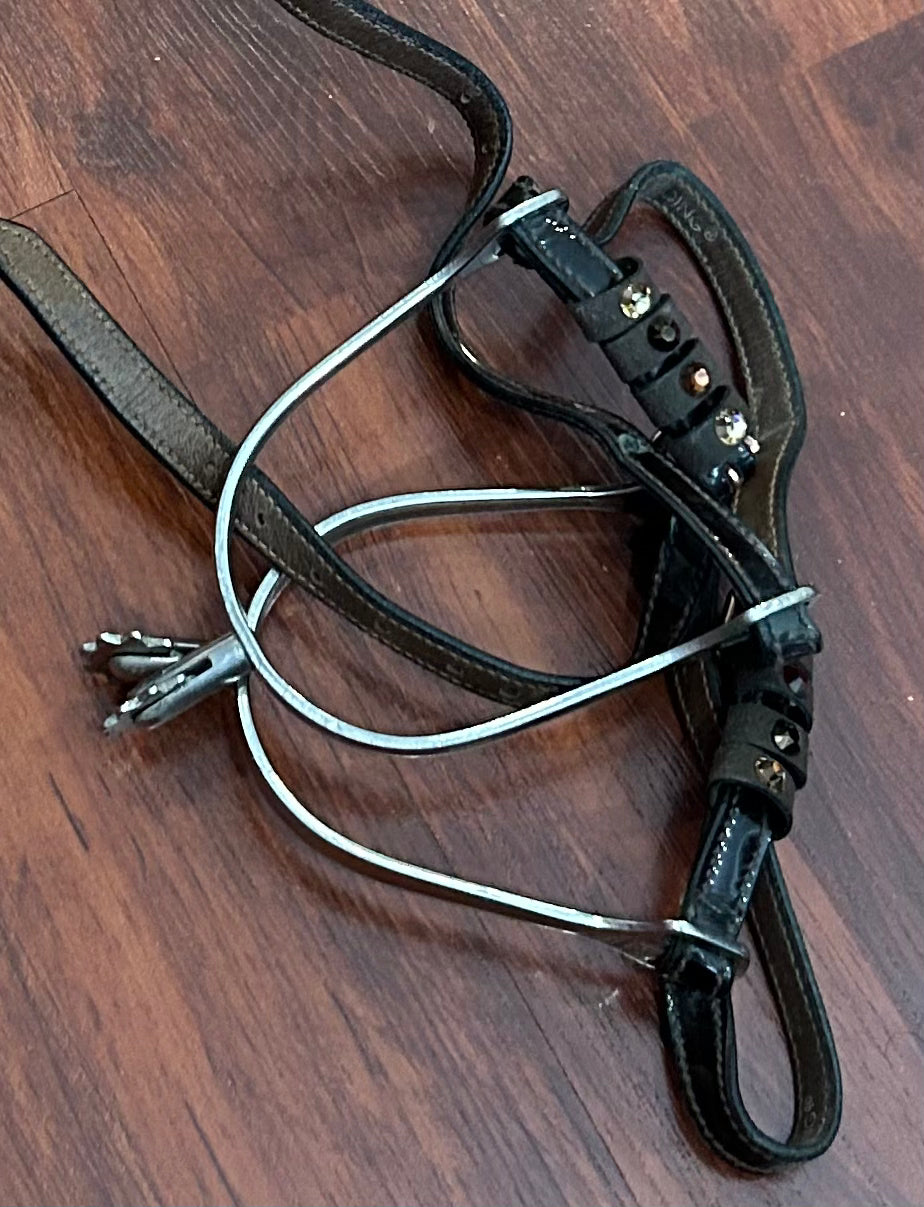 Herm Sprenger rowel spurs with brown patent / stones straps.