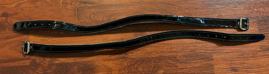 Black patent spur straps.