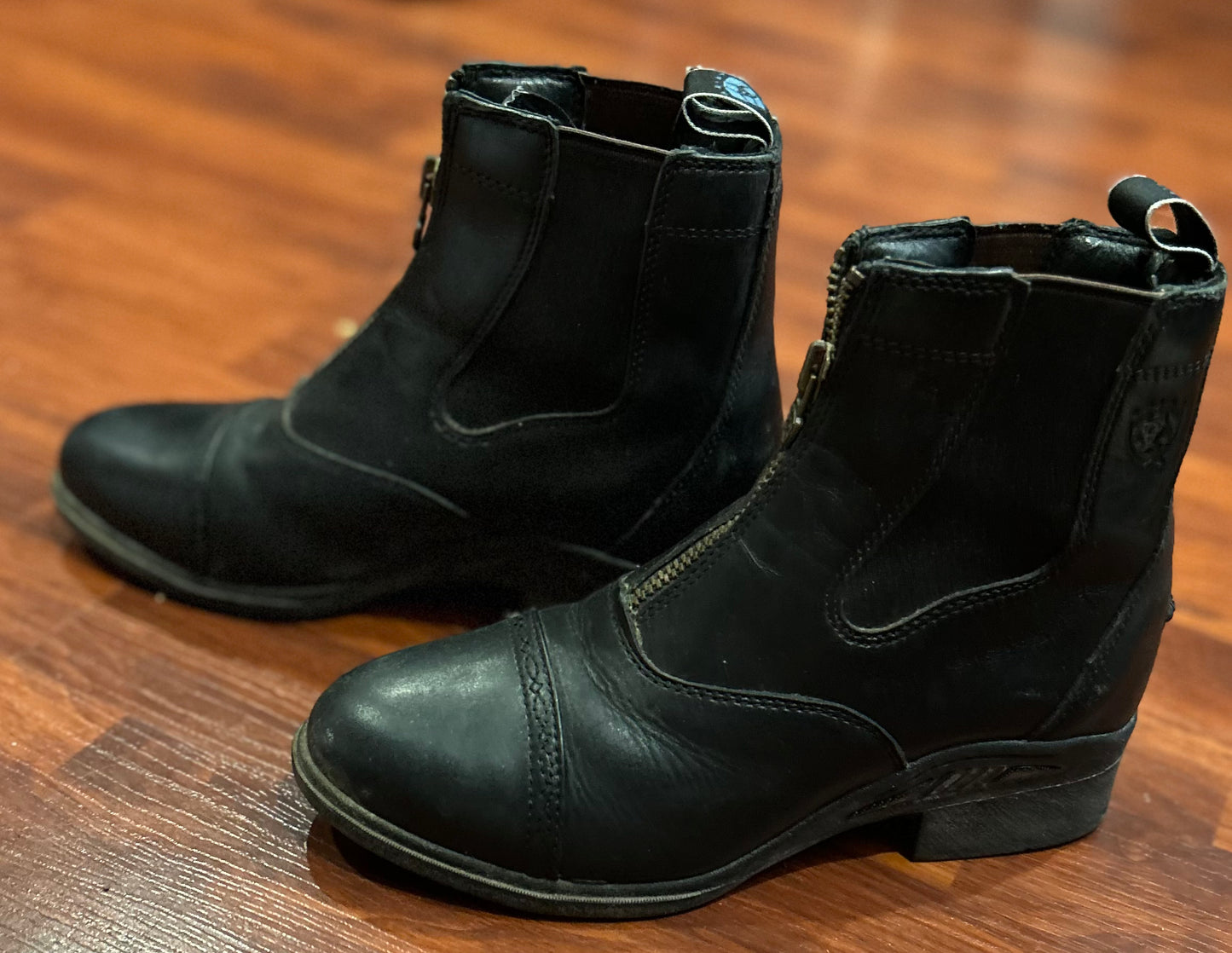 Ariat size 7B paddock boots. Front zip. Excellent condition.