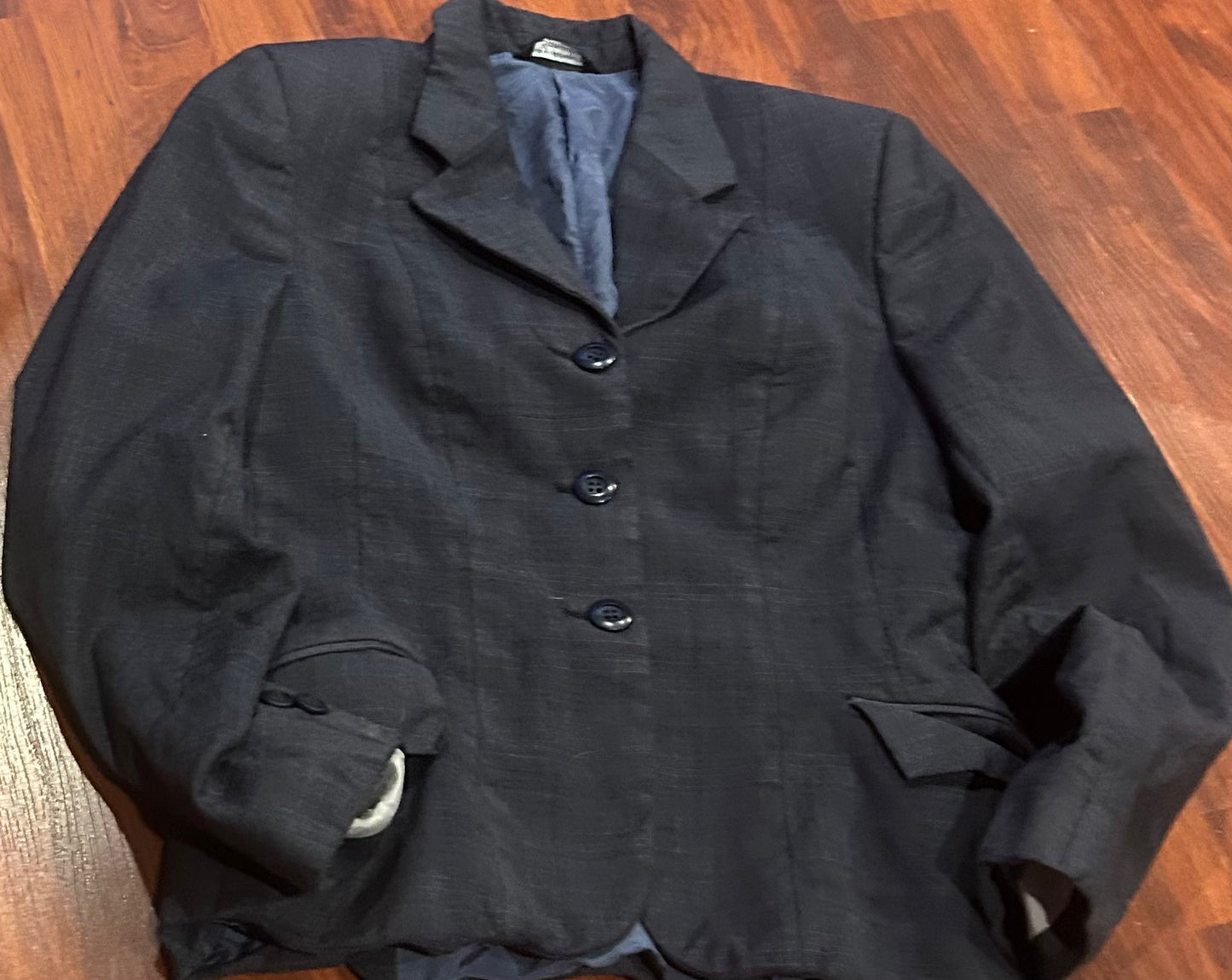 Grand Prix small blue show jacket. Tag removed. Material bunched up from washing.