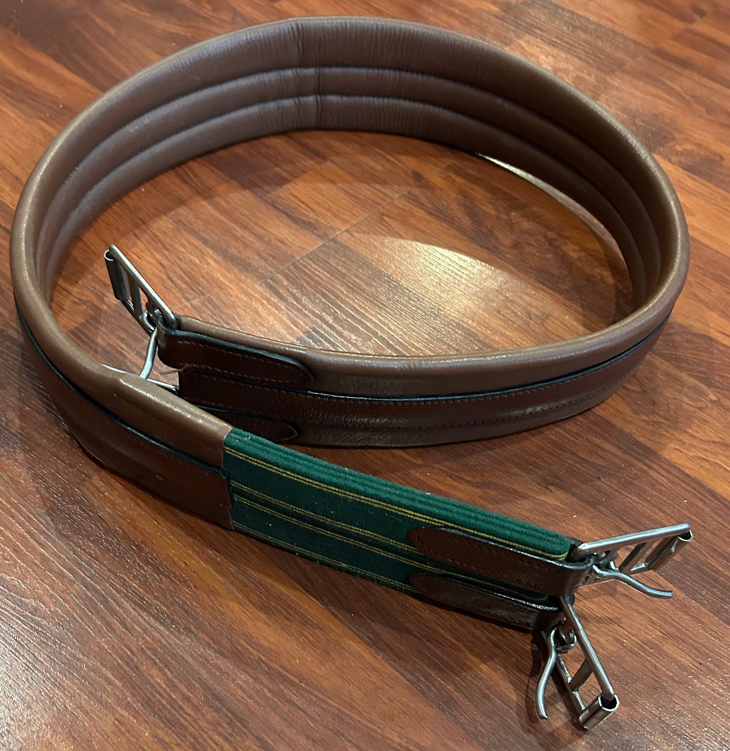 54” Brown leather girth. Elastic one side.