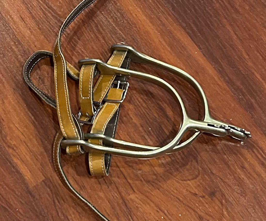 Herm Sprenger rowel spurs with tan leather straps