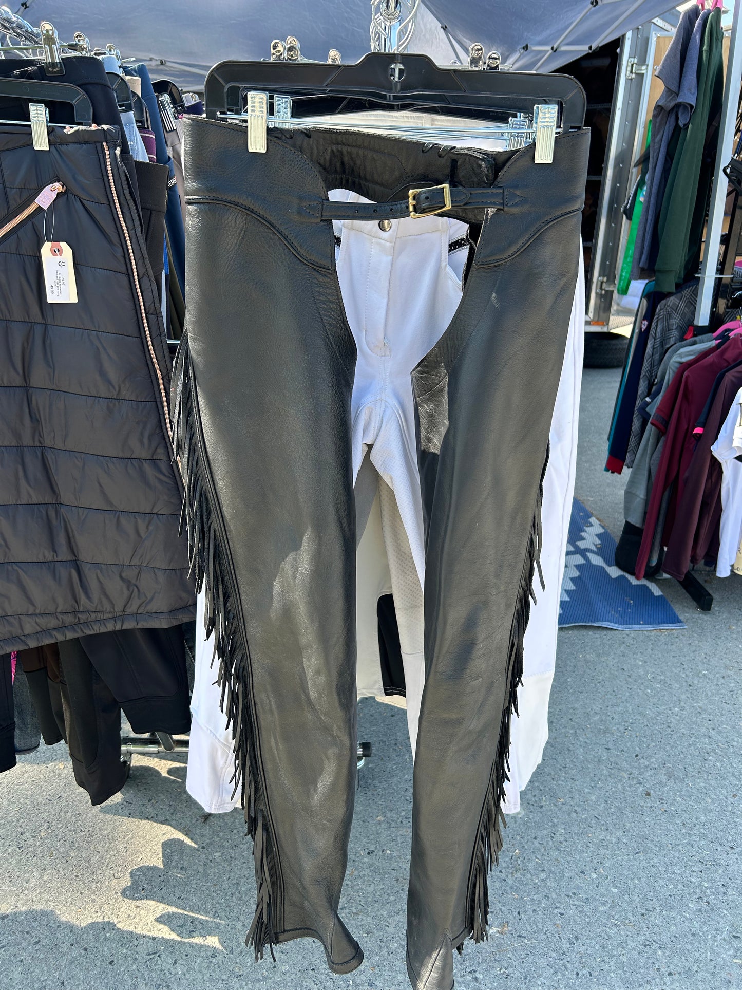 Lynn Saunders full chaps with fringe. Black. Inside leg 31”. Outside leg (waist to bottom) 40”. 13.5” calf. Waist 30”- 27” excellent condition.