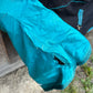 69” Weatherbeeta freestyle rain sheet. Black and teal. Minor lining rips