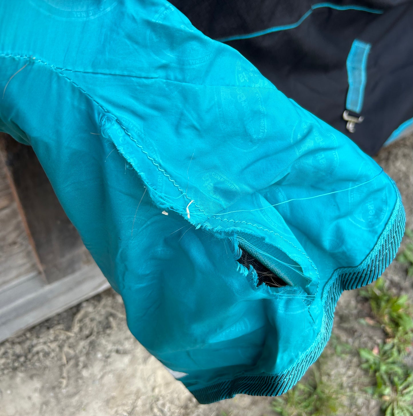 69” Weatherbeeta freestyle rain sheet. Black and teal. Minor lining rips