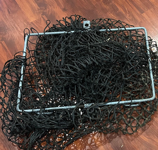 Large fold down hay net with hardware. Holes in net.