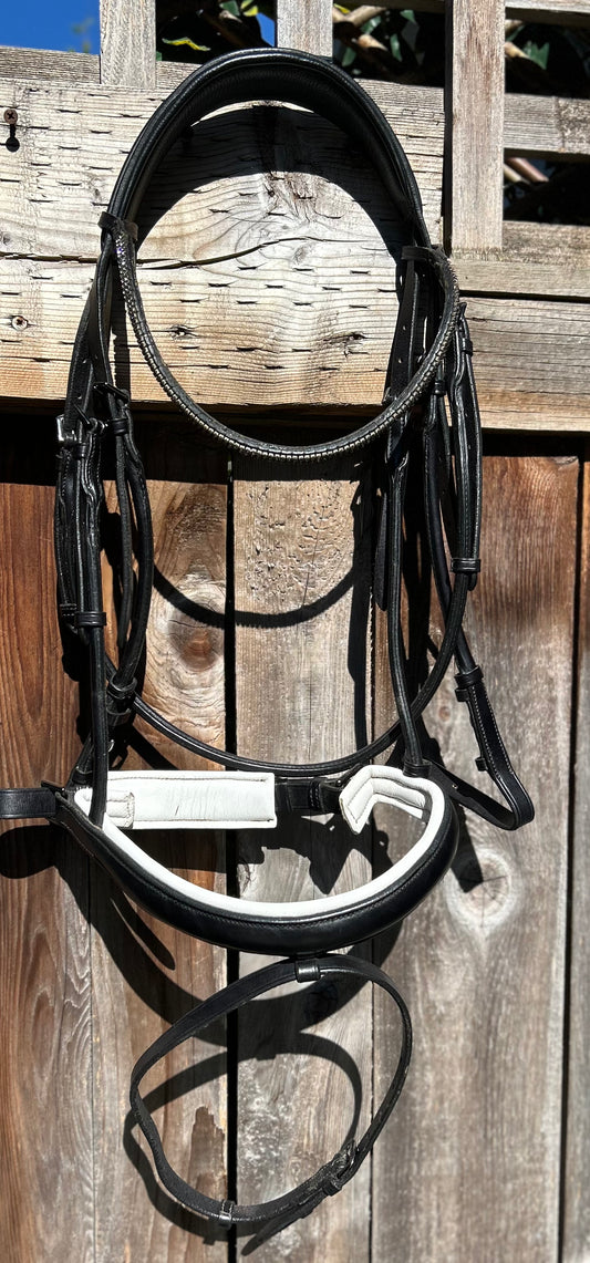 Kingsley full size rolled snaffle bridle. Browband has been changed and is missing stone. Crank noseband. Bridle is new.