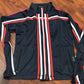 Visualize mesh small training jacket. Navy/red/white stripe.