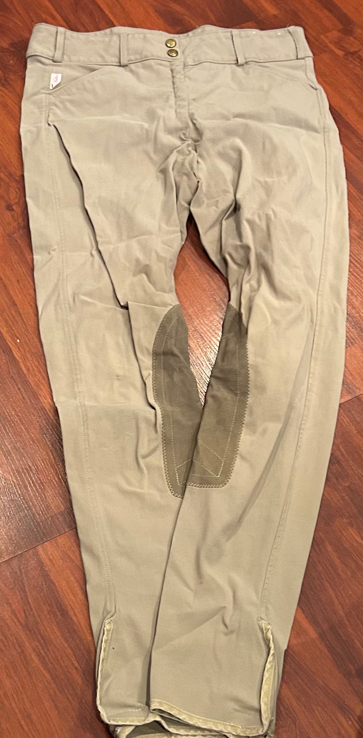 Tailored sportsman size 30 tan knee patch breeches. Velcro ankles