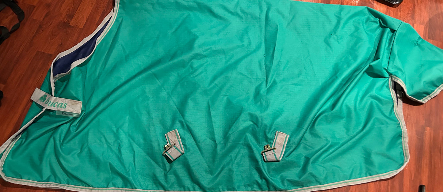 56” bucas freedom rain sheet green (rip on tail)