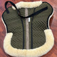 Fleeceworks sheepskin half pad. Saddle area measures 18” along spine. Minor dirt from use.