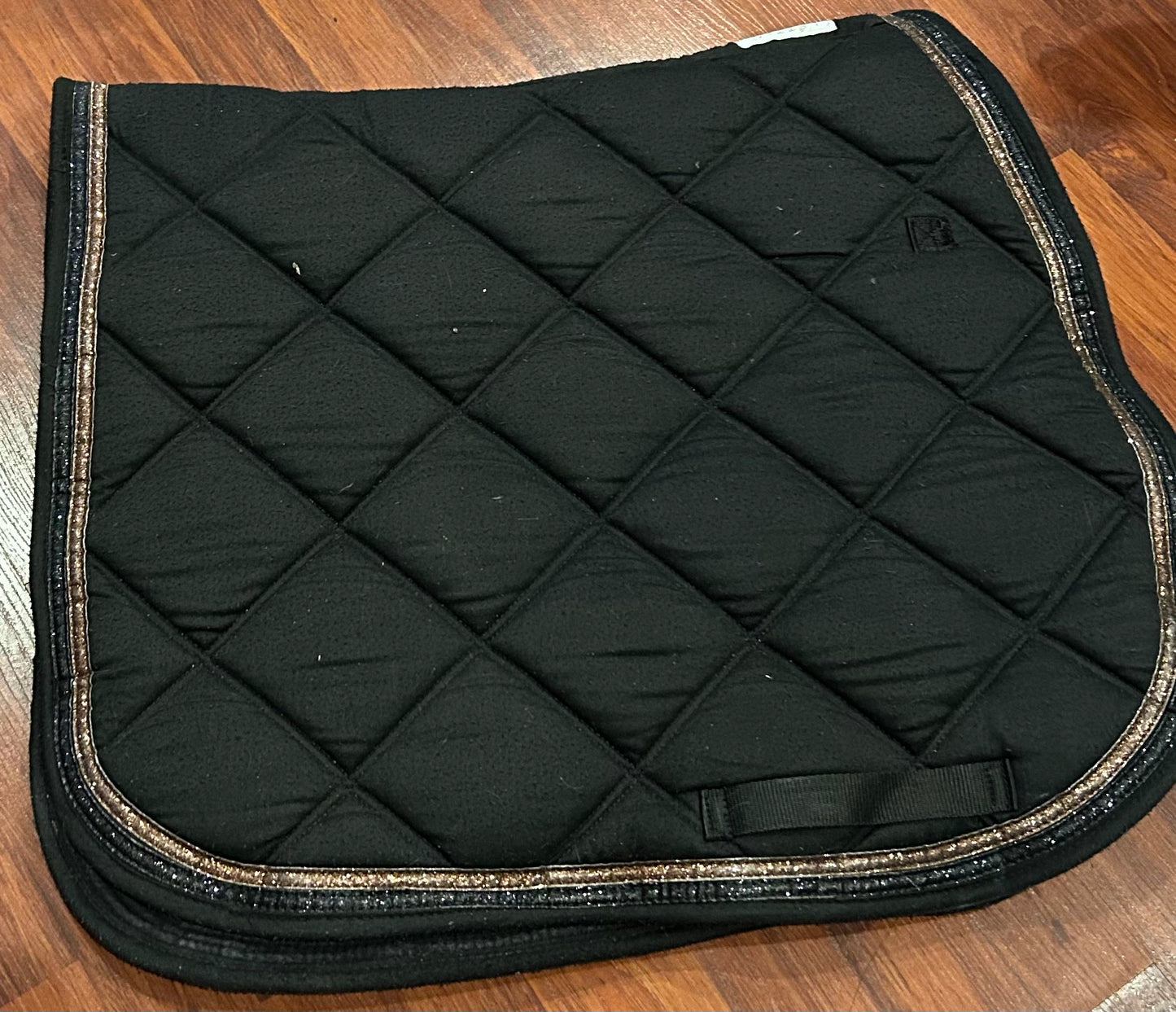 Lettia black with gold trim quilted dressage pad