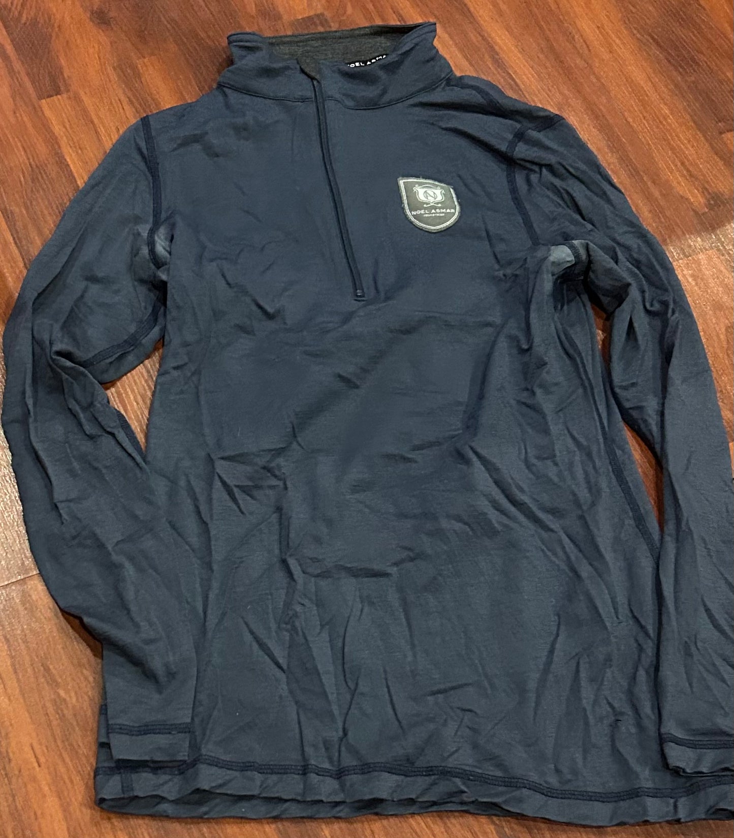 Asmar medium long sleeve blue 1/4 zip. Discoloured under arms