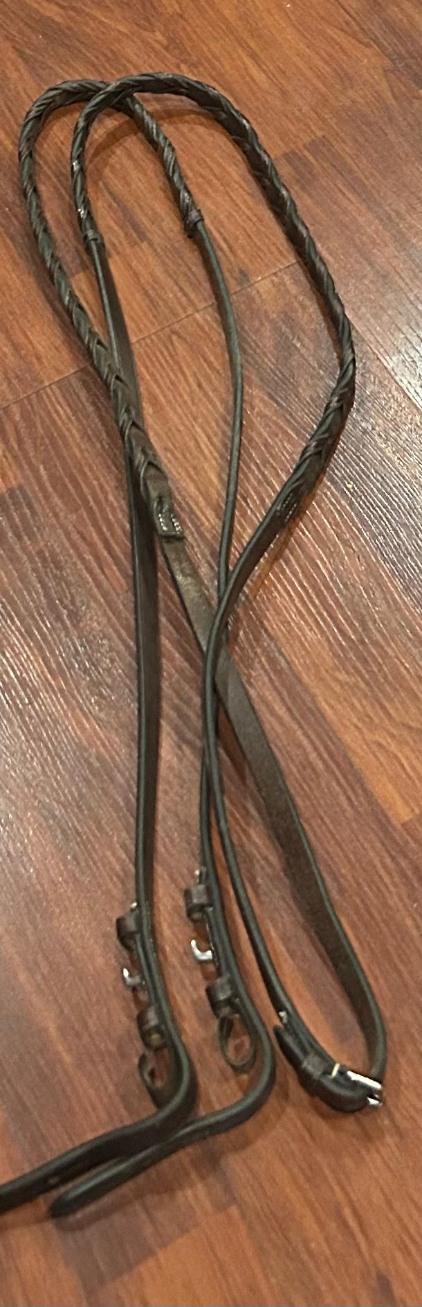 48” brown braided reins. Hook closures. 1/2 inch