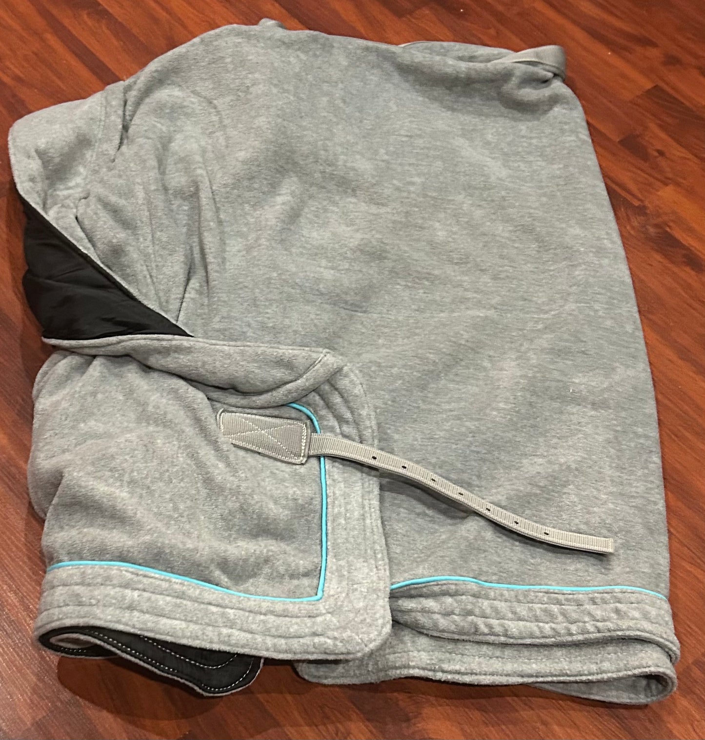 Shedrow large grey with teal piping fleece cooler. Designed without straps