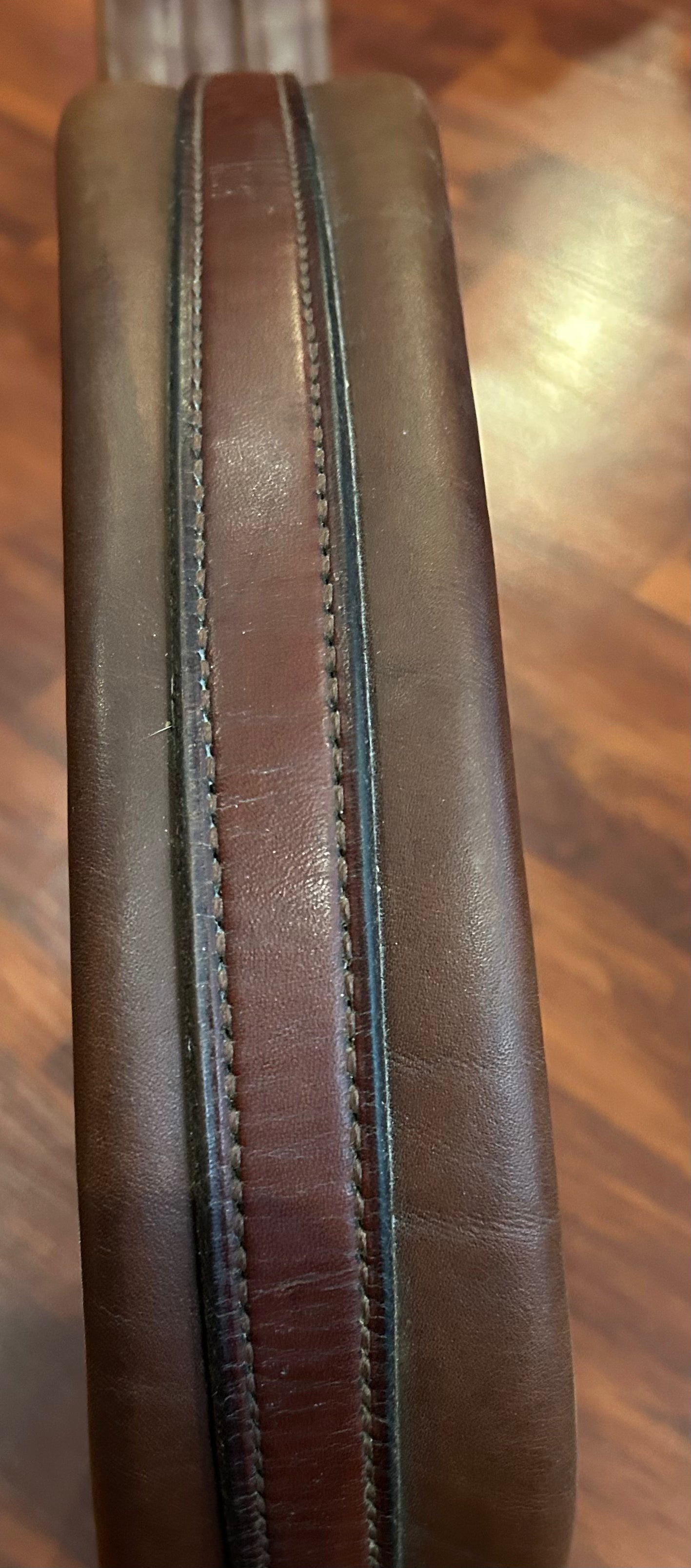 56” brown leather girth. Elastic one end.