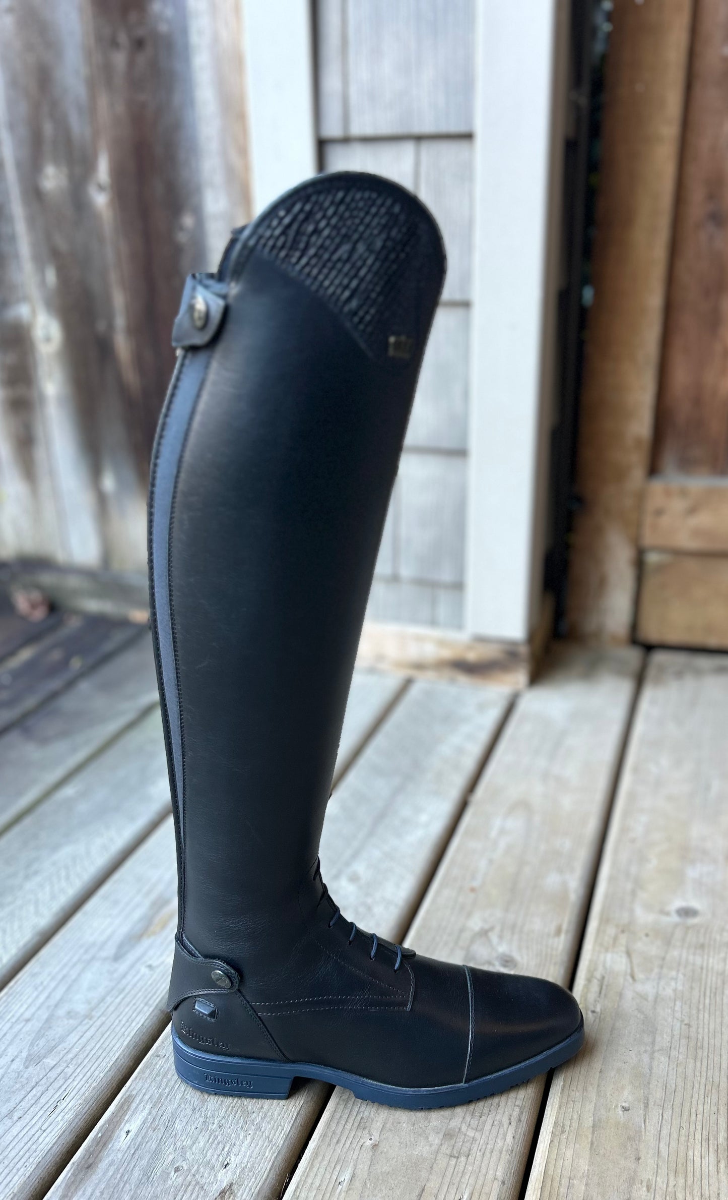 Kingsley size 41 black with blue sole and accents. 14” calf 21” tall