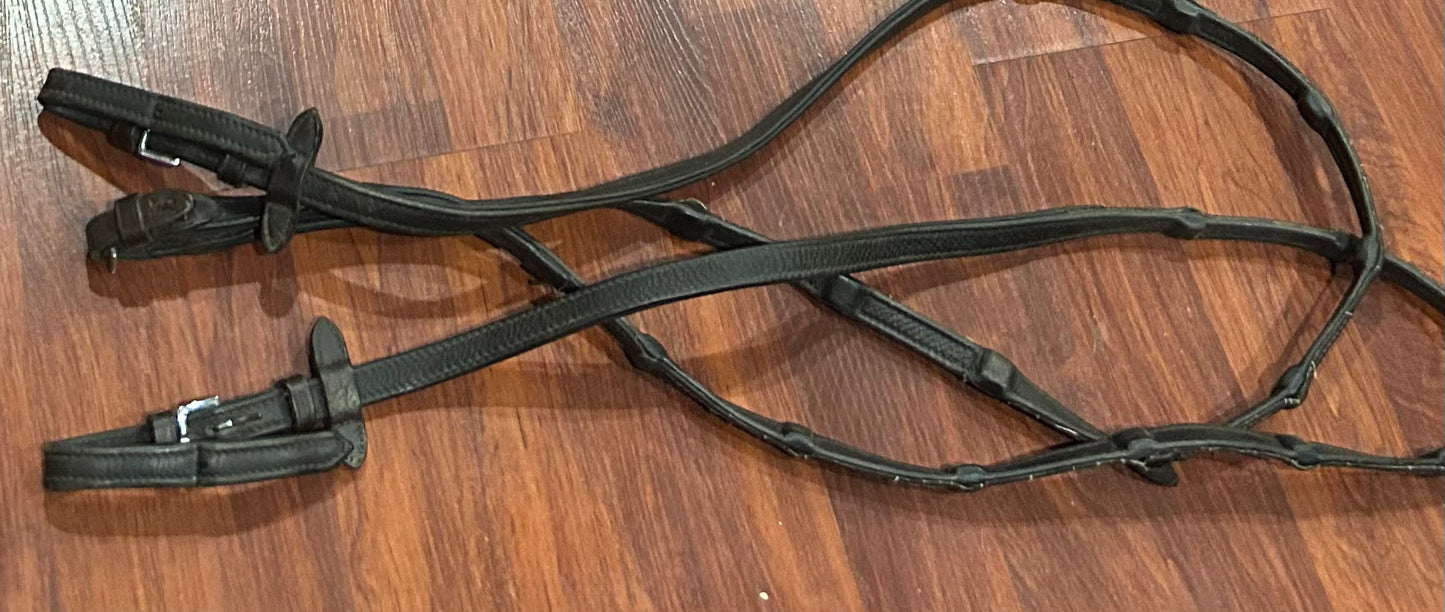 Schockemohle Brown rubber lined reins. Lots of wear but usable