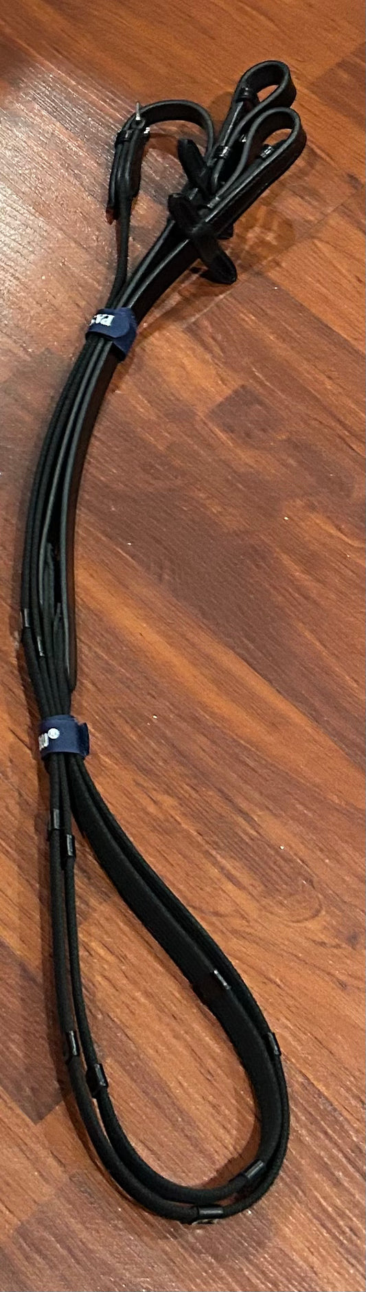 Passierblu webbed with hand stops black cob length reins. Buckle ends. Brand new.