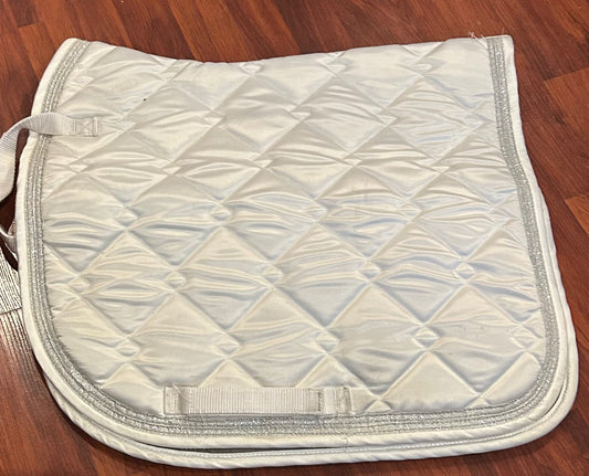 White dressage pad with silver trim. Pony size.