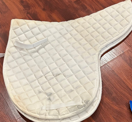 White shaped pad. Stained.