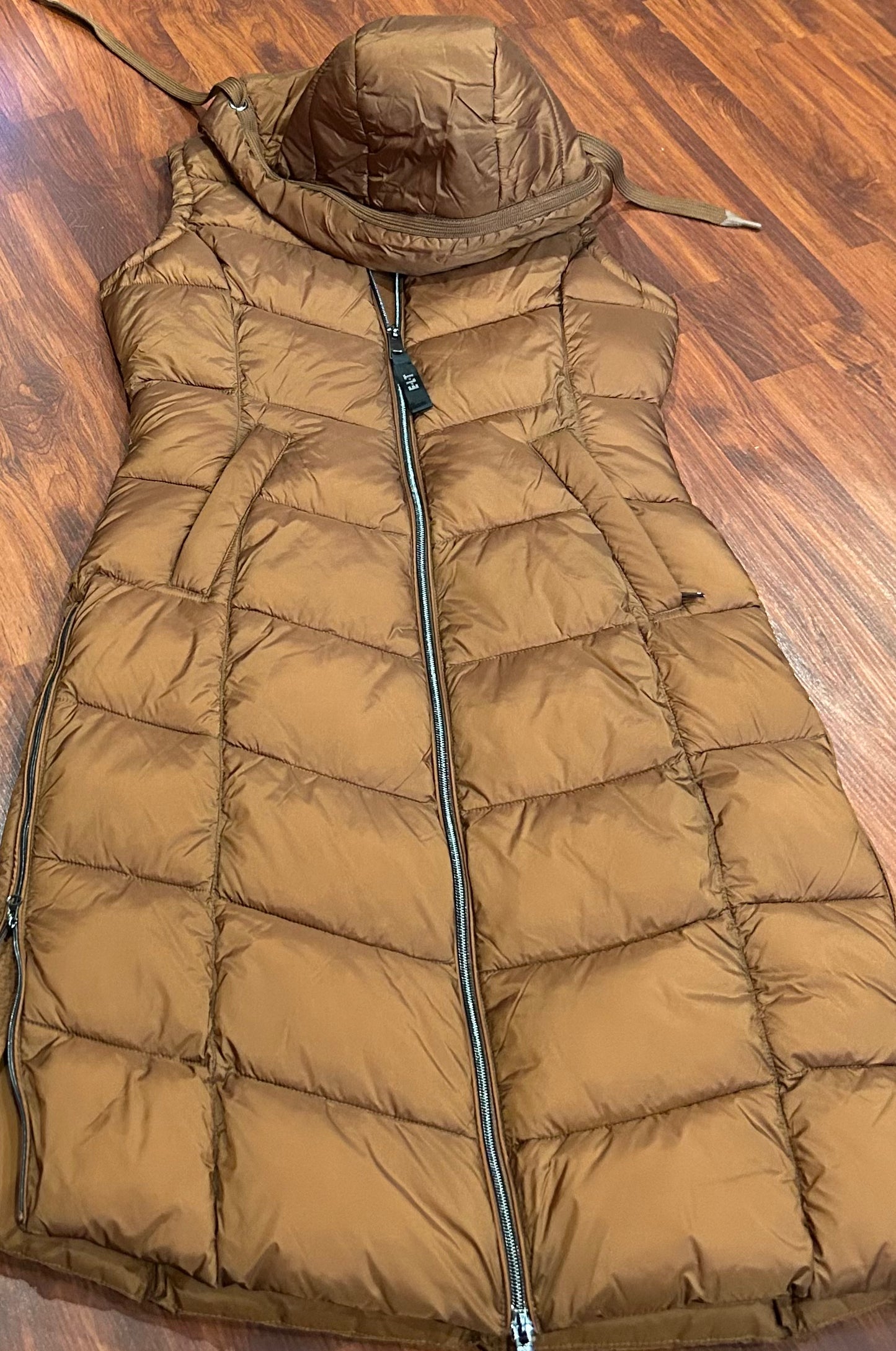 ELT small rust colour long puffy vest. Zippers up sides