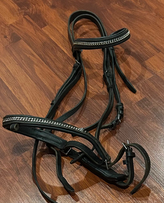 Oversize black bridle with chain decoration. Crank noseband. Some chain is loose