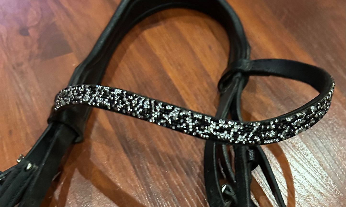 Otto Schumacher full size snaffle bridle with rocks browband. Size 2. Almost new.