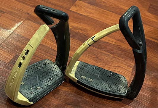 FreeJump stirrups cream and black. Minor damage to foot bed