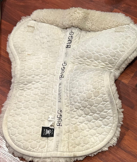Mattes medium white half pad. Some damage to sheepskin