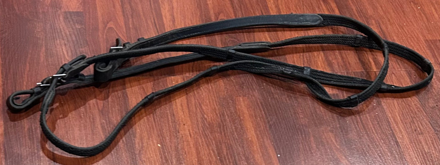 Black webbed/rubber reins with hand stops. Wear but decent condition.