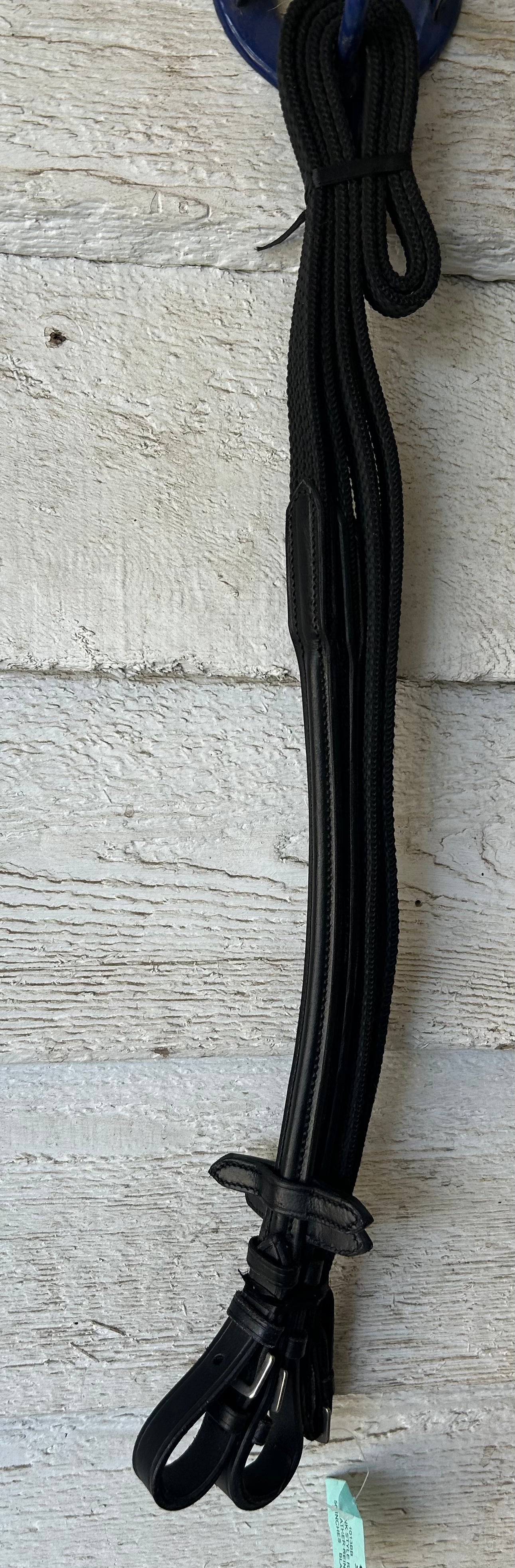 Black reins buckle closure. 56” raised with grippy  rubber.