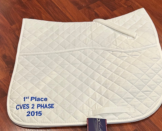 Shedrow quilted. Padded under saddle white dressage pad. CVES one side greenhawk embroidery on other